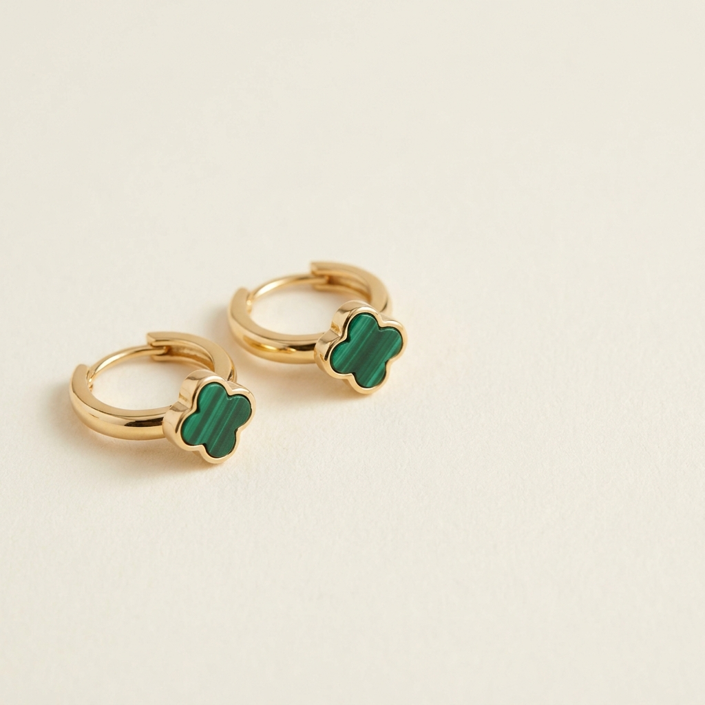 DEAUVILLE Clover Huggies — 18K gold-tone huggie earrings with green clover charm